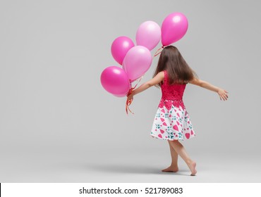 Child girl with balloons