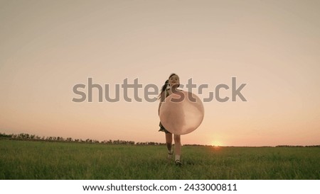 child girl with big ball runs sunset green grass, lawn summer, happy family dream, through picturesque green field, happy childhood memories, joyful childhood memory, enthusiasm, magic my daughter