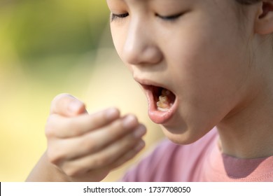 Child Girl Checking Breath With Her Hand,woman Doing A Bad Breath Test After Have Breakfast,foul Mouth From Inside The Tongue,teeth And Gums,oral Bacteria Problems,halitosis,health Care,dental Concept