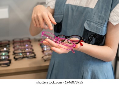 Child Girl Choosing New Glasses, She Pointed Her Finger, Meaning I Chose This One