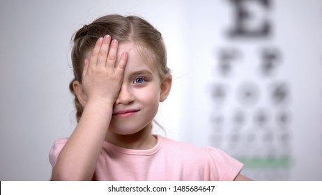 Child Girl Closing Eye, Showing Size Or Sign From Eye Chart, Vision Diagnostics