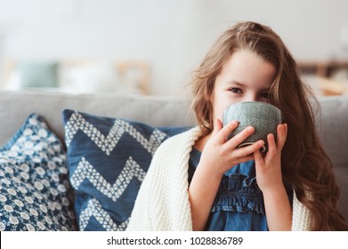 Child Girl Drinking Hot Tea To Recover From Flu. Healing Kids And Protect Immunity From Seasonal Virus, Health Concept