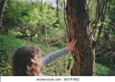 Child Girl Exploring Nature In Early Spring Forest. Kids Learning To Love Nature. Teaching Children About Seasons Changing. Warm Weather.