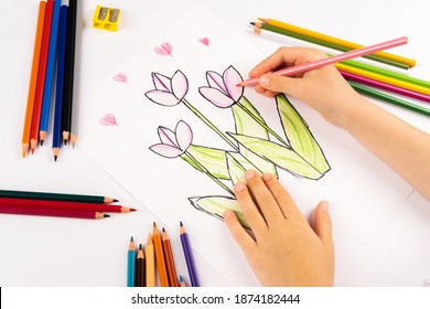 Child girl flowers with multicolored felt-tip pens on a white sheet. - Powered by Shutterstock