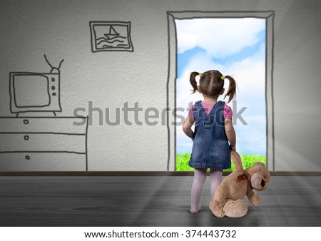 Child girl in front of the drawn door, back view