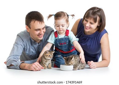 child girl and her parents feeding small kittens - Shutterstock ID 174391469