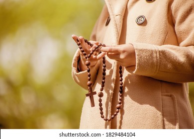 Child Girl Holding Rosary And Praying To God