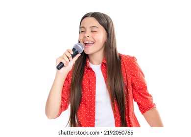 Child Girl Holding Wireless Microphone For Karaoke Singing Or Talk And Speaker On White Background Isolated With Space. Portrait Of Emotional Amazed Excited Teen Girl.