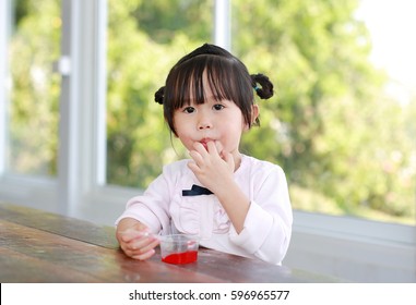 Child Girl Licking Her Fingers