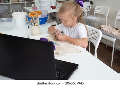 Child Girl Molding In Pottery Online Class By Video Lesson By Ceramic Art Studio. Video Master Class On Creating Ceramic Products. 