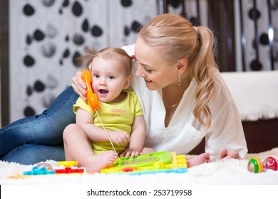 child girl phone with mother playing with toy phone