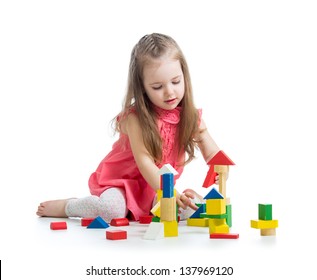 child girl playing with block toys over white background