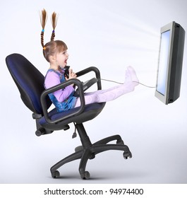 Child Girl Playing Computer Game With Joystick