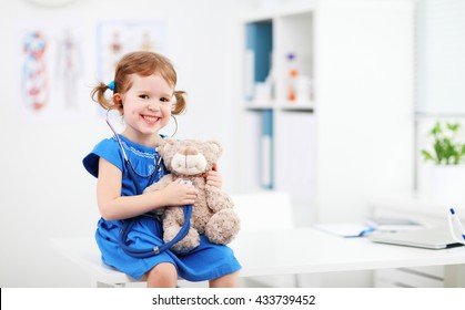 Child Girl Playing Doctor With A Teddy Bear