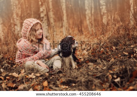 Similar – Foto Bild Herbstporträt eines glücklichen Kindes Mädchens, das mit ihrem Hund spielt.