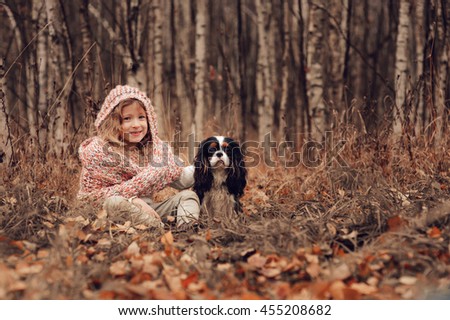 Similar – Foto Bild Herbstporträt eines glücklichen Kindes Mädchens, das mit ihrem Hund spielt.