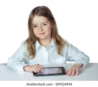 Child Girl Sit Table Ipad Laptop Isolated On White.Kid Use Electronic Wireless Device.