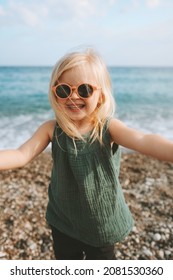 Child Girl Taking Selfie On Sea Beach Baby Happy Smiling Wearing Sunglasses 3 Years Old Kid Traveling Outdoor Family Fun Vacations 