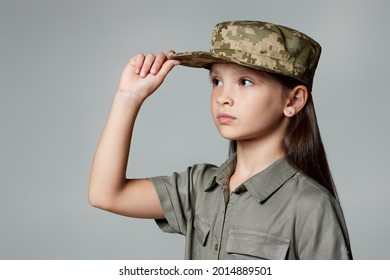 Child Girl Wear Military Uniform. Kid Dressed Like A Soldier