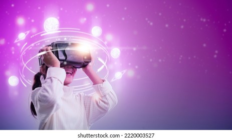 Child girl wearing virtual reality headset and looking at digital space system with planets or Universes. Space exploration with augmented reality glasses. - Powered by Shutterstock