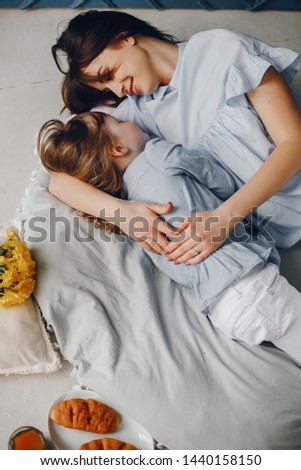 Similar – Image, Stock Photo Relaxed mother and sons embracing lying in the bed