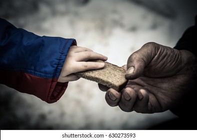 The child gives the man a piece of rye bread.

