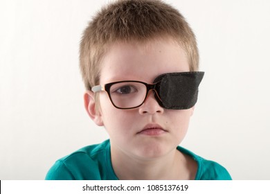 Child In Glases With Occluder. 
Ortopad Boys Eye Patces Nozzle For Glasses For Treating Strabismus (lazy Eye)