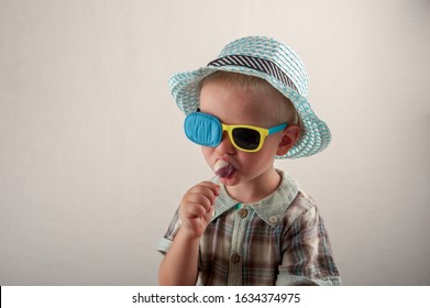 Child In Glases With Occluder. Ortopad Boys Eye Patces Nozzle For Glasses For Treating Strabismus (lazy Eye)