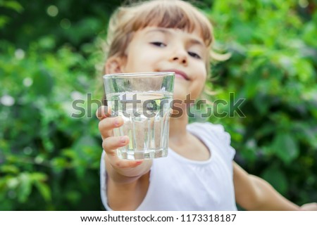 child glass of water. selective focus. Children
