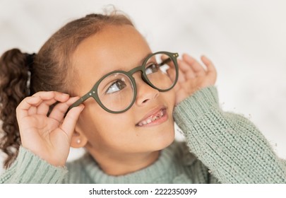 Child, glasses and eye care for vision, focus and concentration while wearing quality lens frame optician choice. Face of girl looking happy about optics fashion mockup for eyesight correction