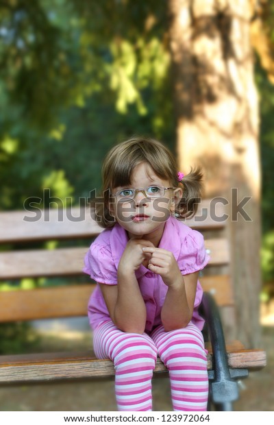 Child Glasses Sitting On Bench Soft Stock Image Download Now
