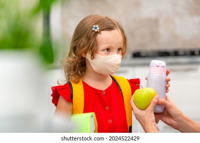 Child Going Back To School. Mother And Kid Getting Ready For First School Day After Vacation. Little Girl And Mom Going To Kindergarten Or Preschool. Student Holding Books, Apple And Lunch