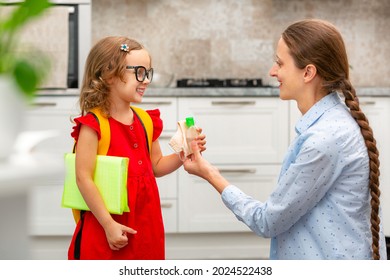 Child Going Back To School. Mother And Kid Getting Ready For First School Day After Vacation. Little Girl And Mom Going To Kindergarten Or Preschool. Student Holding Books, Her Hands