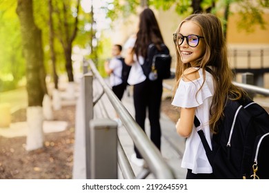 Child going back to school. Start of new school year after summer vacation. Little girl with backpack and books on first school day. Education for kindergarten and preschool kids - Shutterstock ID 2192645591