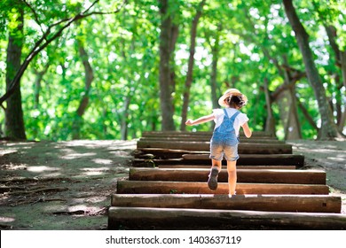 Child Going Up The Stairs In The Forest