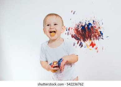 The Child Got Dirty Colors. Eat Paint And Smiles.