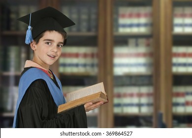 Child Graduation Cap And Books In The Library