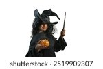 A child in a Halloween witch costume with a magic wand