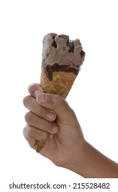 Child Hand Holding A Chocolate Ice Cream Scoop On Cones