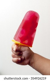 Child Hand Holding A Watermelon Ice Cream Bar