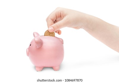 Child Hand Putting Coin Into Money Box.