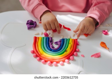 Child Hands Creating Rainbow From Play Dough For Modeling. Art Activity For Kids. Fine Motor Skills. Sensory Play For Toddlers.