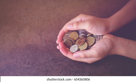 child hands holding Australian money, donate concept