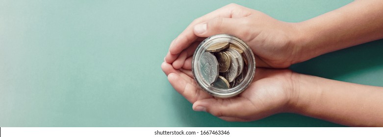 child hands holding money jar, donation, saving, charity, family finance plan concept, Coronavirus economic stimulus rescue package, superannuation concept