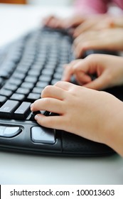 Child Hands Typing On Keyboard