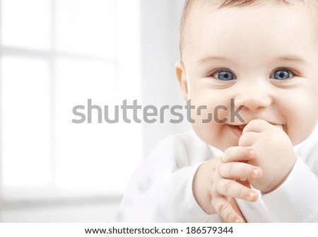 child, happiness and people concept - adorable baby