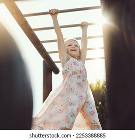 Child, happy or playing on monkey bars in park, nature garden or house backyard on holiday vacation or summer break. Jungle gym, exercise or fun hanging game for smile, kid or girl in energy climbing - Powered by Shutterstock