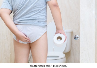 Child Has Diarrhea Holding His Butt In Toilet,diarrhea Constipation. Health And Cleanliness Concept