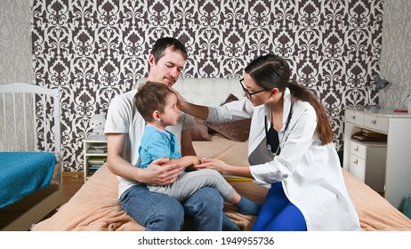 The Child Has A Fever, A Doctor's Visit At Home. High Quality Photo