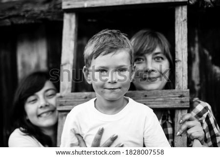 Similar – Mother with her seven year old daughter laughing in a cabin in the countryside.